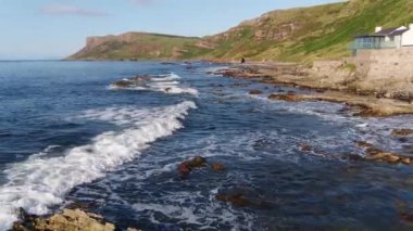 Aerial video of Fair Head Atlantic Ocean Co Antrim Coastline Northern Ireland