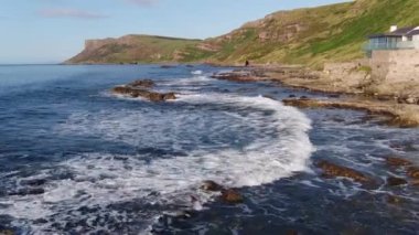 Aerial video of Fair Head Atlantic Ocean Co Antrim Coastline Northern Ireland