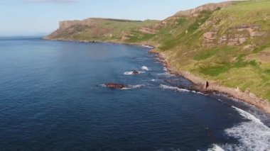 Aerial video of Fair Head Atlantic Ocean Co Antrim Coastline Northern Ireland