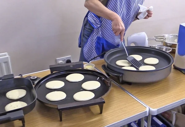 Pancake baking in a kitchen