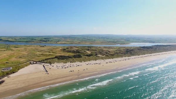 Portstewart Strand Beach with cars on sand and Atlantic ocean north Coast Co. Antrim Northern Ireland