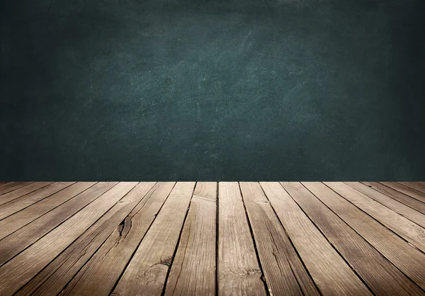 Wood plank table with blackboard background — Stock Photo, Image