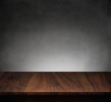 Wood table with dark concrete texture background clipart