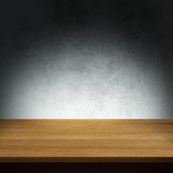 Wood table with dark concrete texture background