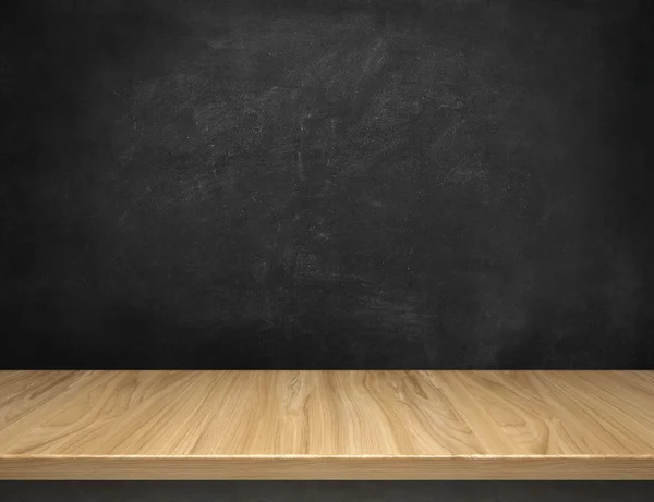 Wood table with blackboard background — Stock Photo, Image