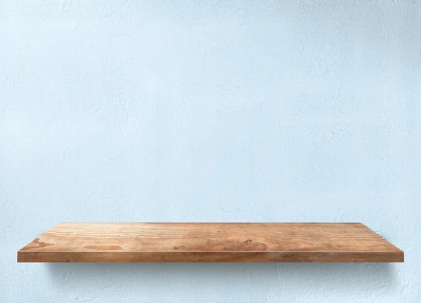 Mesa de madeira com parede azul clara — Fotografia de Stock
