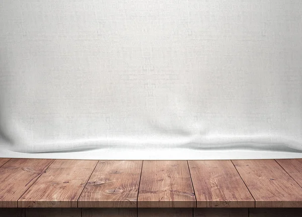 Wood table with white fabric background — Stock Photo, Image