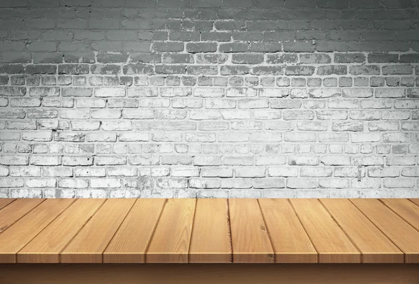 Mesa de madera con fondo de pared de ladrillo blanco —  Fotos de Stock