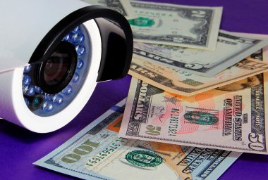 Control of financial flows (video camera and money) clipart