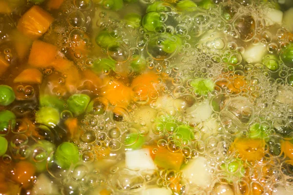 Vegetables in boiled water — Stock Photo, Image