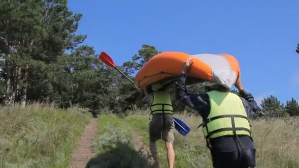 Russia, Siberia 2014: Two people wearing orange inflatable boa — Stock Video