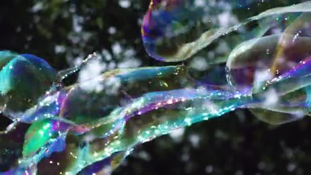 Multi-colored big bubble blower. Bubble wand. Soap bubbles show. — Stock Video