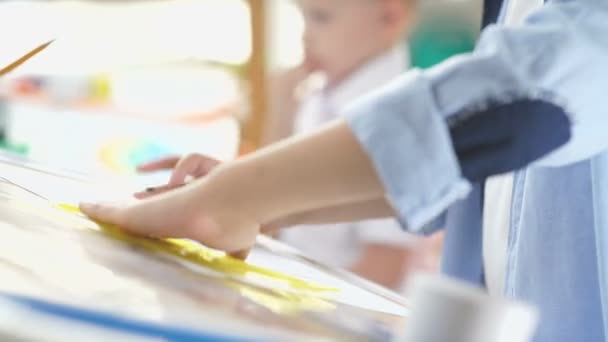 Close-up of childrens hand with a pencil and a ruler — Stock Video