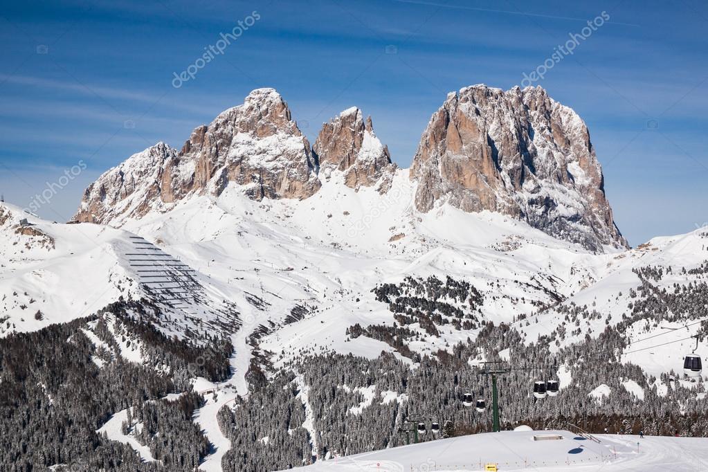 View of the Sassolungo (Langkofel) Group of the Italian Dolomites in Winter from the Belvedere Ski Area in Canazei.