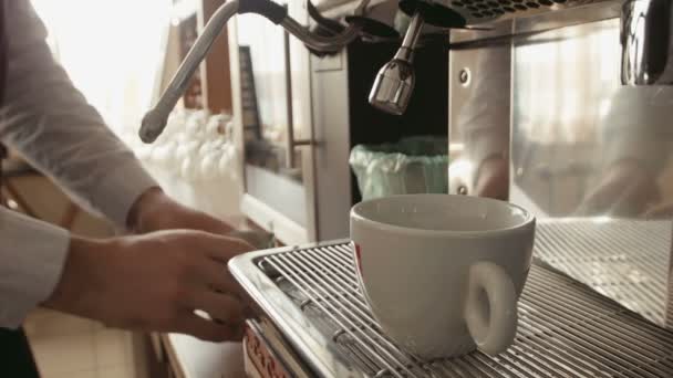 Barista makes latte cappuccino in coffee machine — Stock Video