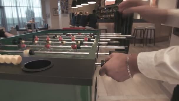 Young couple playing in table football — Stock Video