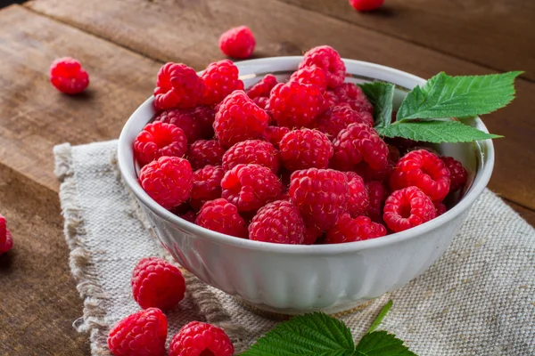 Some ripe and fresh raspberry in white cup Stock Photo