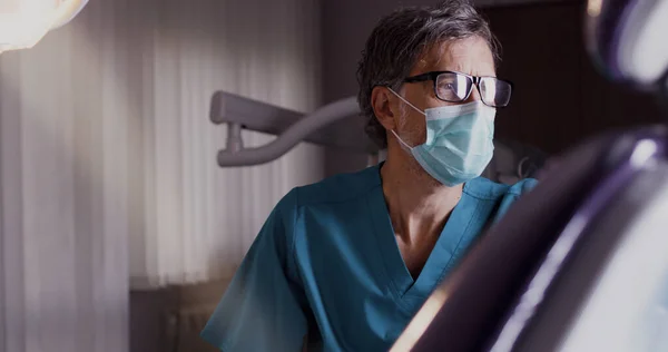 Mature doctor preparing for appointment — Stock Photo, Image