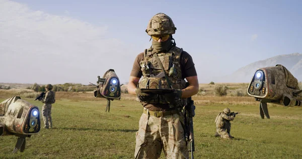 Military man launching drones in field