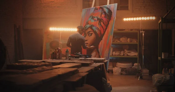 stock image Man painting portrait of African woman