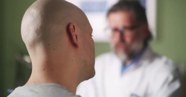 Man with cancer crying and speaking with doctor — Stock Video
