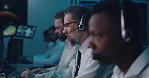 Male operators working in control center — Stock Video