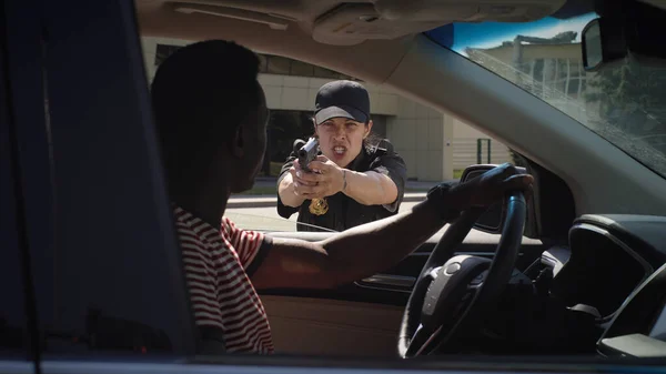 Police officers arresting African American driver — Stock Photo, Image