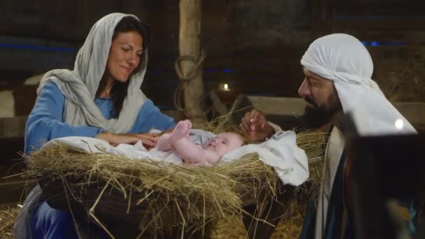 Mary and Joseph admiring son of God — Stock Video