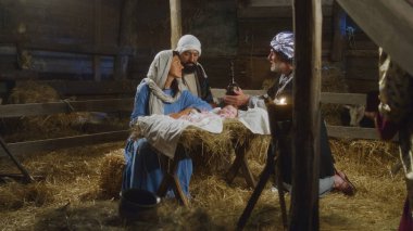 Magi bebek İsa 'ya hediye veriyor.