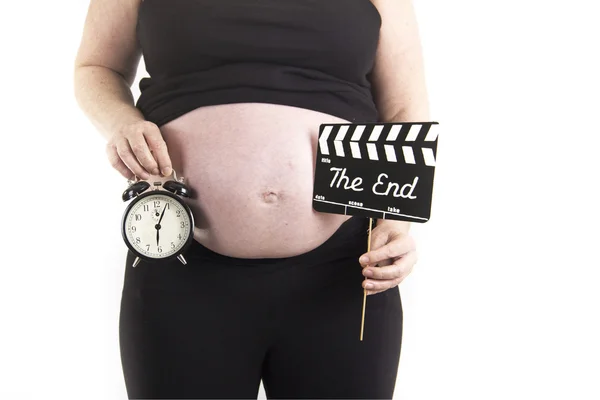 Těhotná žena budík včas — Stock fotografie