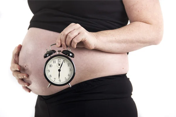 Pregnant woman alarm clock due time — Stock Photo, Image