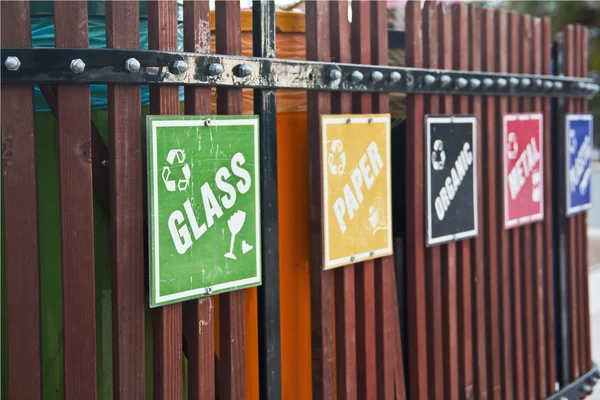 Recycle bin place with signs like glass, paper, metal — Stock Photo, Image