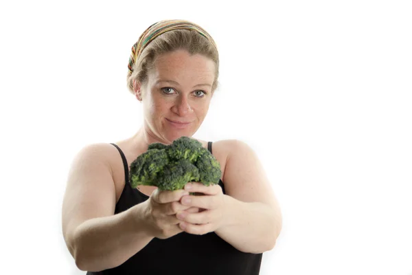 Kobieta w ciąży w ręku trzymając brokuły na białym tle na białym tle — Zdjęcie stockowe