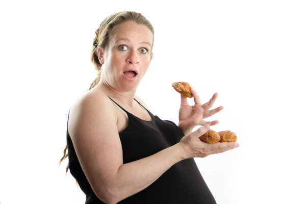 pregnant woman eating croissant isolated on white background