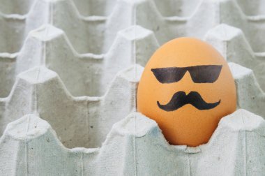 mustache face Eggs  arranged in carton