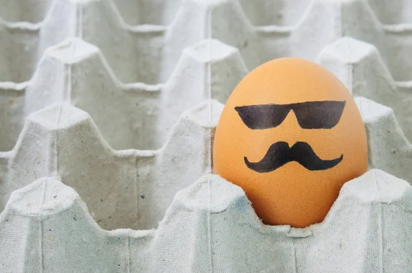 Mustache face Eggs  arranged in carton — ストック写真