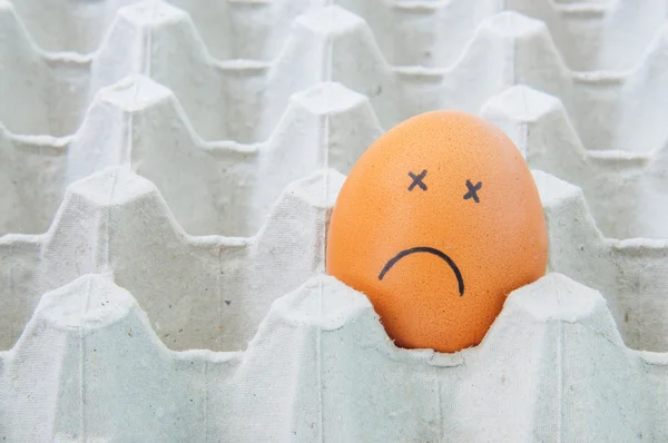 sick face Eggs in brown paper box