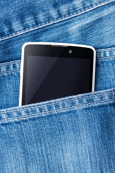 Mobile phone is in the pocket blue jeans.