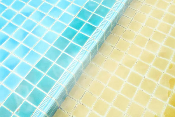 A refreshing yellow swimming pool  in condominium — Stock Photo, Image