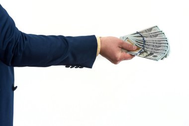 Bir ürün ya da hizmet satın alan ya da kiralayan, dolar veren, beyaza izole edilmiş bir iş adamı. Erkek el rüşvet teklif ediyor.