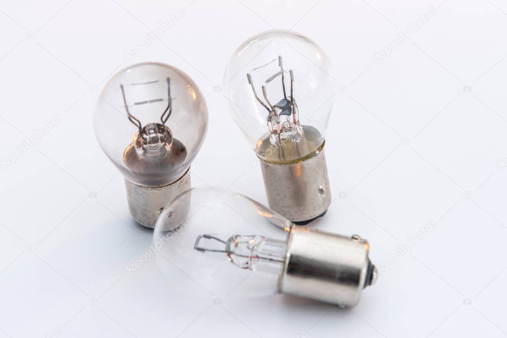 Electric light bulb isolated on color background. Eauipment for car headlight, technology