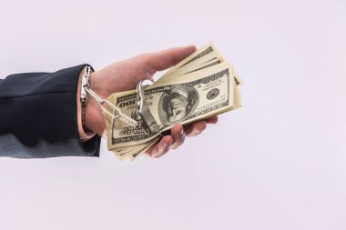 İş adamlarının elleri tutsakları dolarla kelepçeler. Yolsuzluk suçu ve rüşvet kavramı