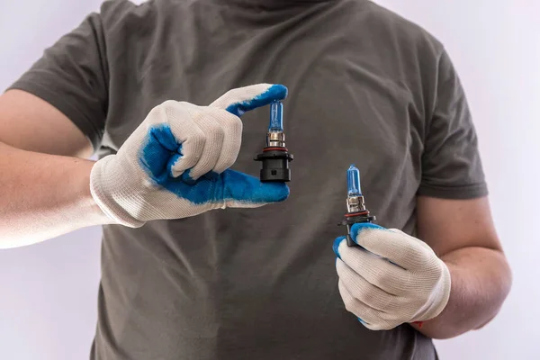 Male Hand Gloves Holding Car Bulbs Headlight Isolated Auto Equipment — Stock Photo, Image