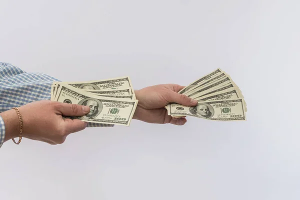 Males hand hold us money bills isolated, finance concept