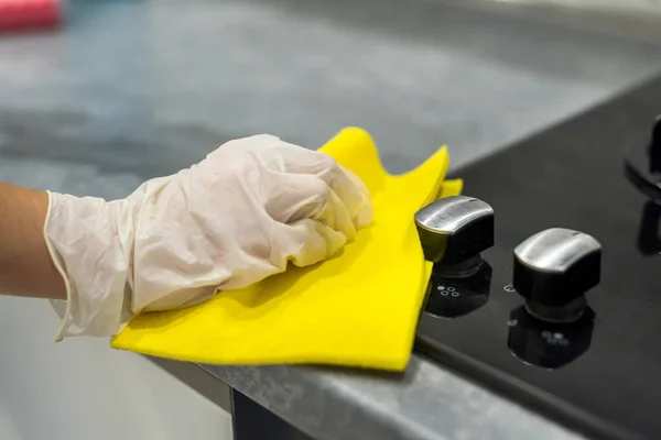 Female Hand White Gloves Cleaning Foam Gas Stove Glass Surface Royalty Free Stock Images