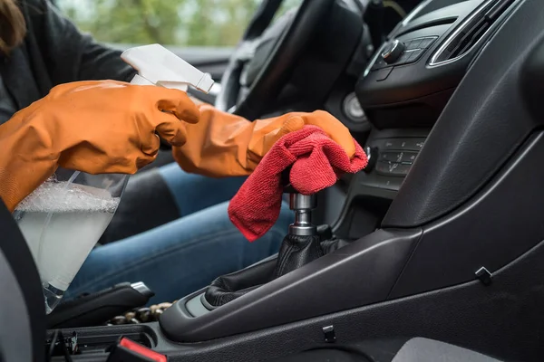 worker hand wear glove cleaning car interior for prevention covid-19. conept of  hygiene