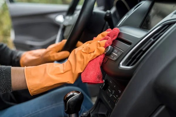 worker hand wear glove cleaning car interior for prevention covid-19. conept of  hygiene