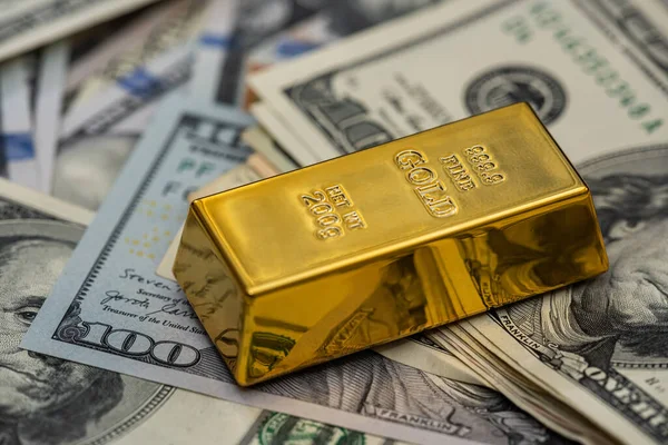 finance concept dollar bills and gold bar. money background