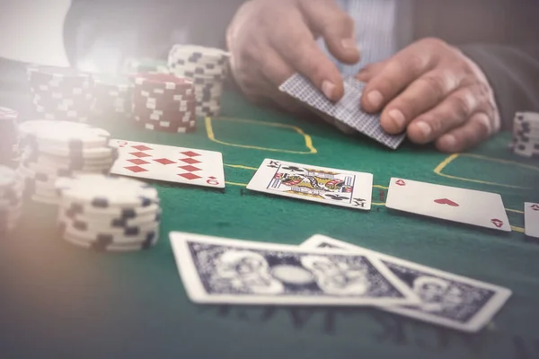 Man Play In Casino With Playing Cards And Chips At Green Table Gambling Risk Adult Stock Photo 423826640