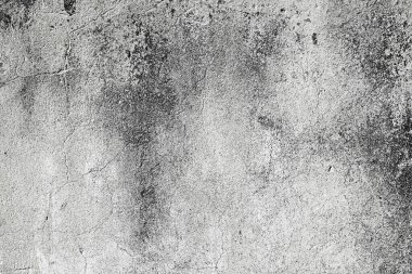 Yüzeyi pürüzlü gri beton duvar dokusu. Yıpranmış çimento ve doğal kusurları olan soyut bir arka plan..